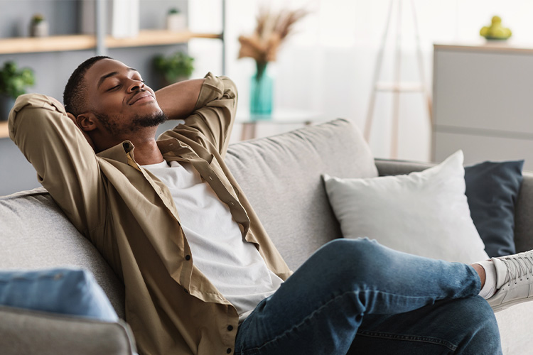 A black male relaxing after a successful mental health counseling session.